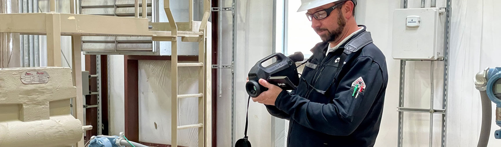 A Crestwood employee filming on a camcorder at a worksite